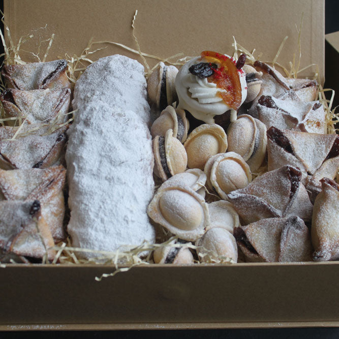 Luxury festive gift box with handmade pastries and cakes from North London bakery.
