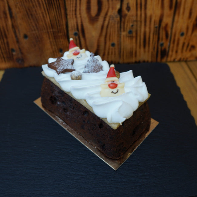 Traditional Christmas fruit cake loaf decorated for the festive season.