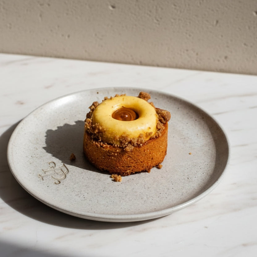 Apple crumble tart with golden shortbread crust, vanilla cream and caramel drizzle