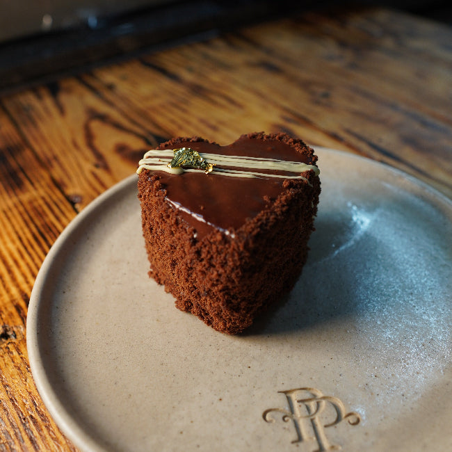 dark chocolate mousse heart shaped cake close up luxury bakery london