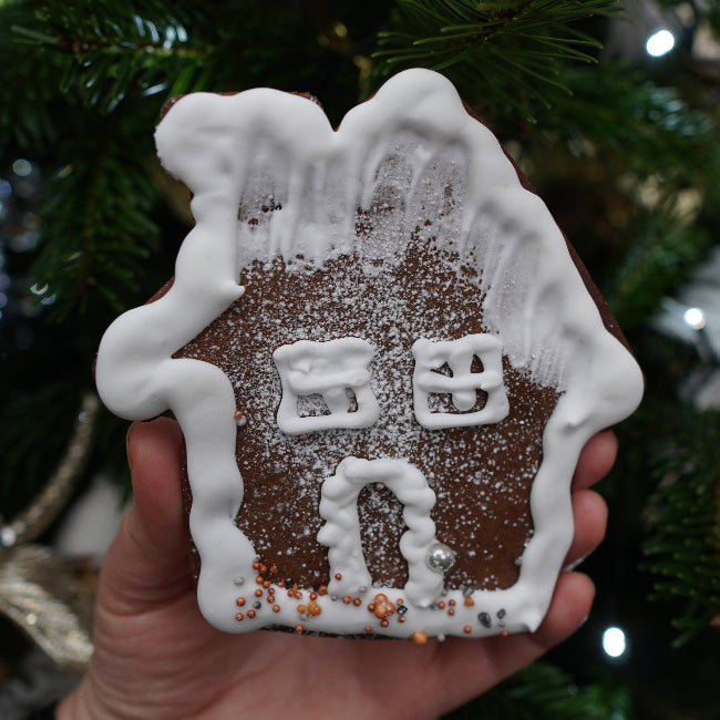 Handcrafted gingerbread house decorated for Christmas, baked by Prestige Patisserie
