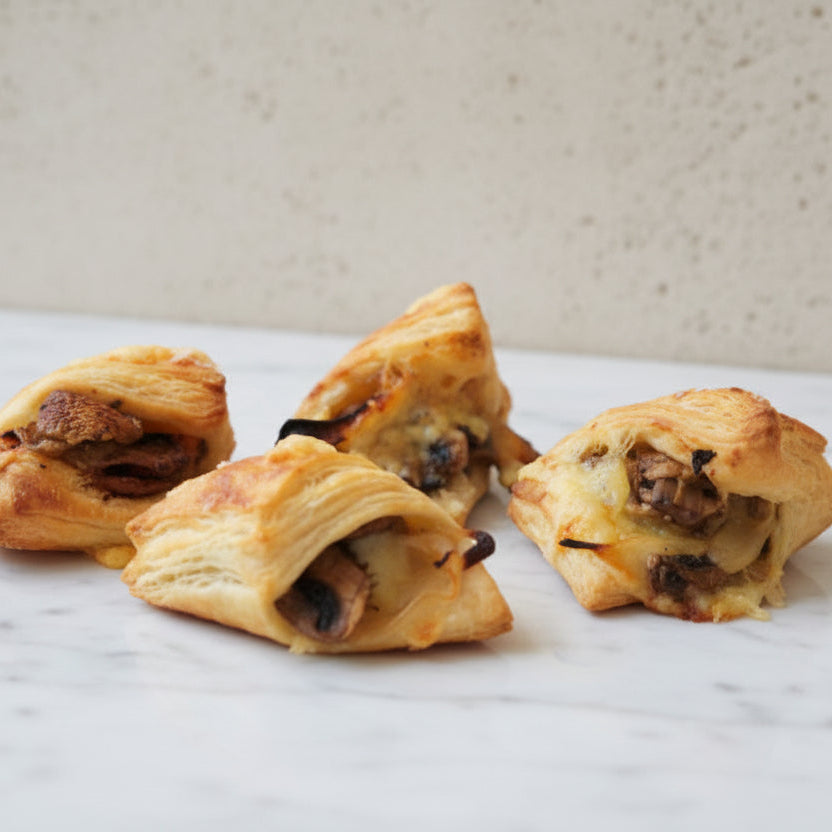 Vegetarian mushroom onion cheese puff pastry canapés artisan savoury pastries handmade in North London bakery