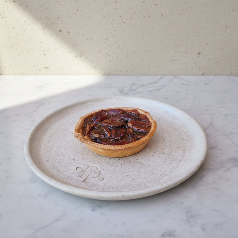 Maple-glazed pecan tart in golden pastry shell, handmade in North London