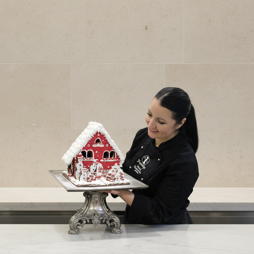 Prestige Patisserie showstopper gingerbread house in red icing gift box.