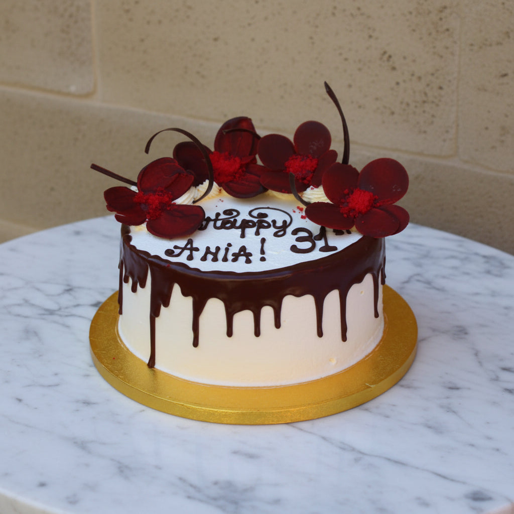 Prestige Patisserie birthday cake with chocolate flowers design and chocolate drip