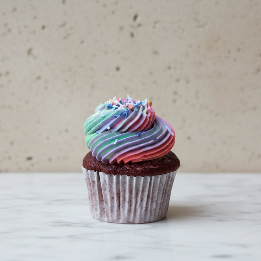 Custom-decorated chocolate cupcakes with coloured frosting