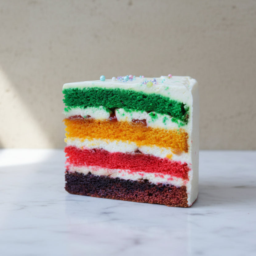 colourful rainbow celebration cake from Prestige Patisserie London