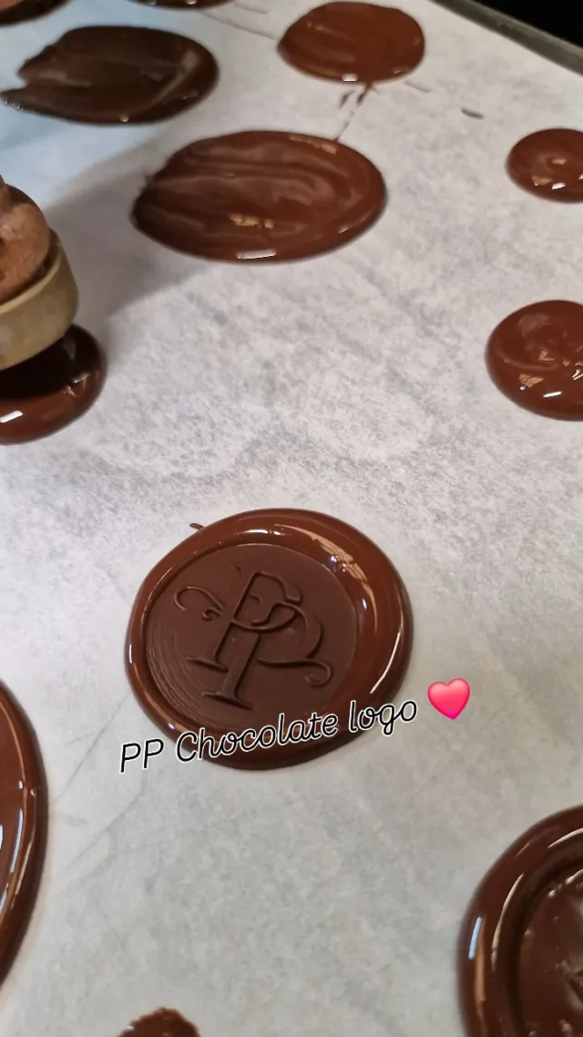 This is how we create our Prestige Patisserie logo using tempered dark chocolate and a custom seal ❤️