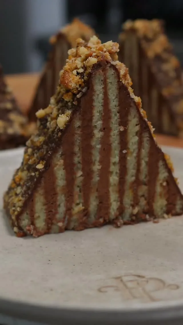A little beauty moment for our Carpathian Mountain Cake.  Inspired by the Romanian Prăjitura Carpați we remember from childhood, but recreated in our own way with Jaconde sponge, dark chocolate & honey mousse, ganache and walnut brittle.  The full recipe and complete tutorial are now live on YouTube.  Save this if you want to try it later.  #PrajituraCarpati #CarpathianMountainCake #RomanianDessert #PastryChef #PrestigePatisserie