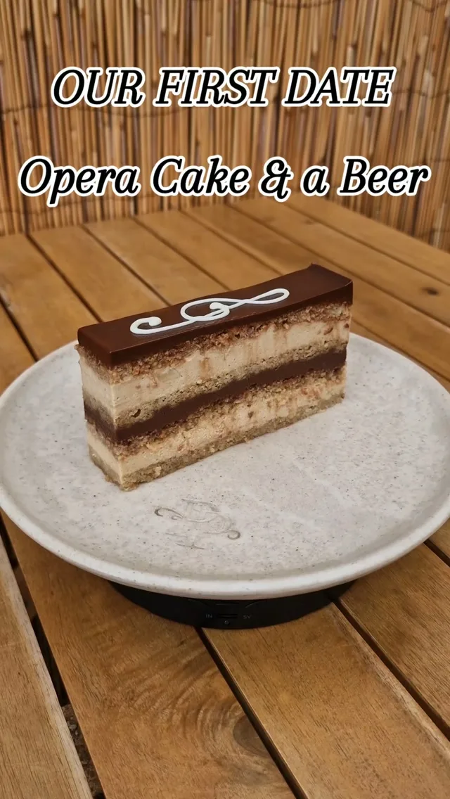Almost 26 years ago, our first date took place at Opera Patisserie in Iasi, Romania - a place very close to Geanina’s heart because it was where she had done her apprenticeship and later worked.  So of course, she knew exactly what to order.
Her favourite at the time: Opera Cake.  And George?  He looked at the cakes and thought, “No chance. I’m a man. I’ll have a beer.”  Apparently, Geanina’s first thought was something along the lines of:  “Oh dear… I think this is the wrong guy for me.”  Well… almost 26 years later, he’s still here.  And somehow, the man who ordered a beer in a patisserie ended up building one with her.  Funny how life works.  Opera Patisserie. Opera Cake. Our first date. One memory we’ll never forget.  #OperaCake #PrestigePatisserie #OurStory #FirstDateStory